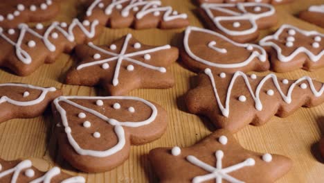 Decorating-Gingerbread-Cookies-for-Christmas,-Closeup-Macro-Shot-Making-handmade-festive-new-year-sweets-and-cookies-with-white-glaze-icing