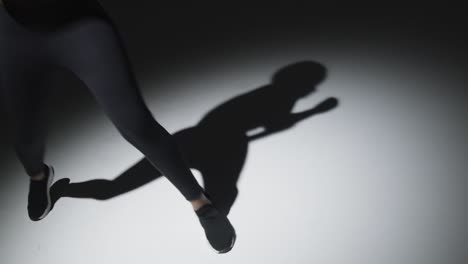 close up studio shot of woman shadow boxing in gym 1