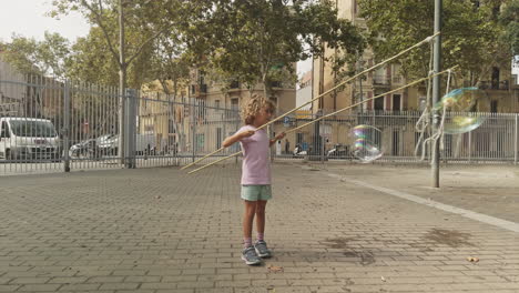 cute young child making bubbles