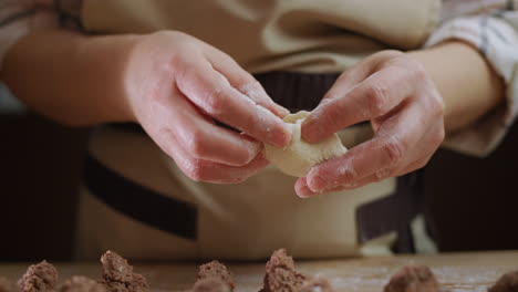 A-professional-baker-makes-dumplings-with-meat-filling.-Delicious-traditional-Ukrainian-cuisine