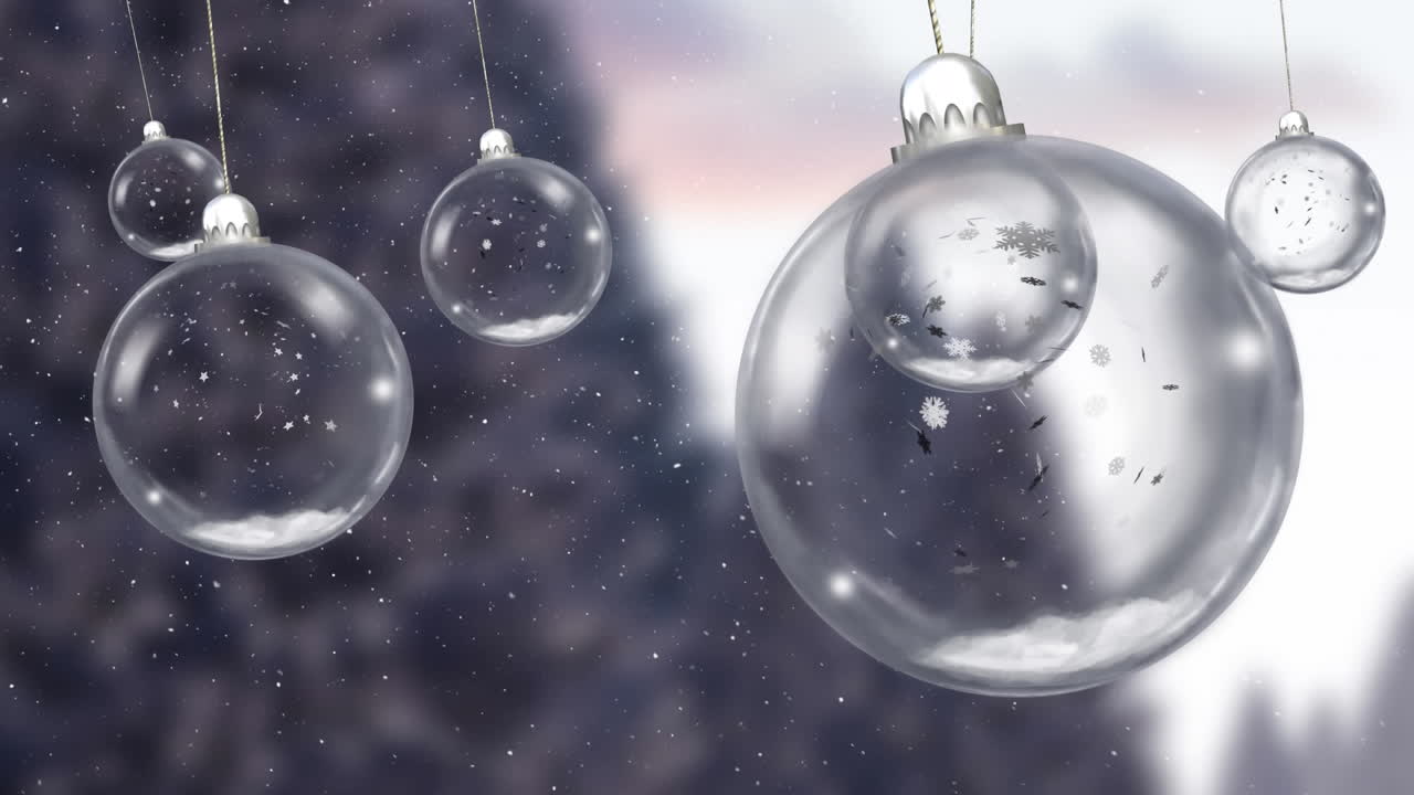 Animation af dinglende julekugler over faldende sne i et vinterlandskab