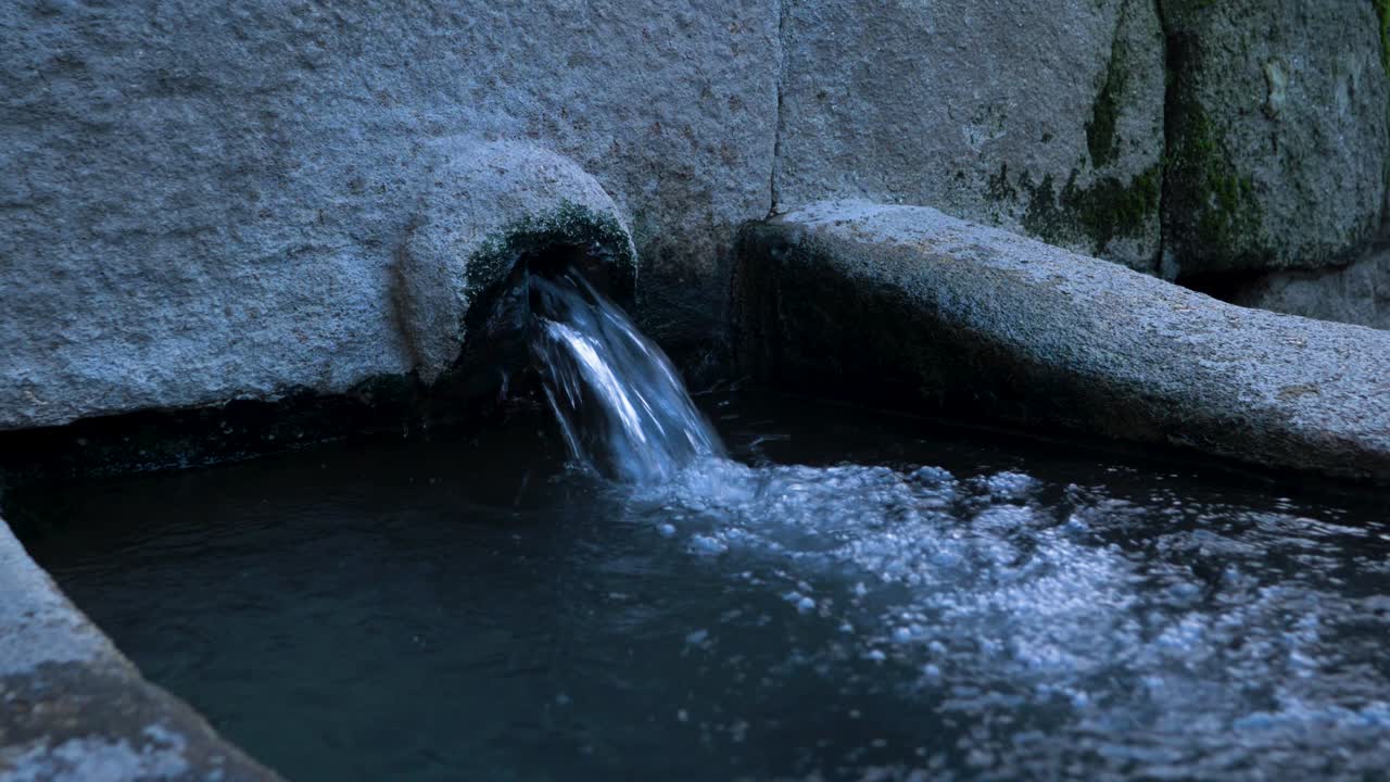 Burga of hot thermal water bubbles into catchment basin in Ba&ntilde;os de Molgas, Ourense, Galicia, Spain