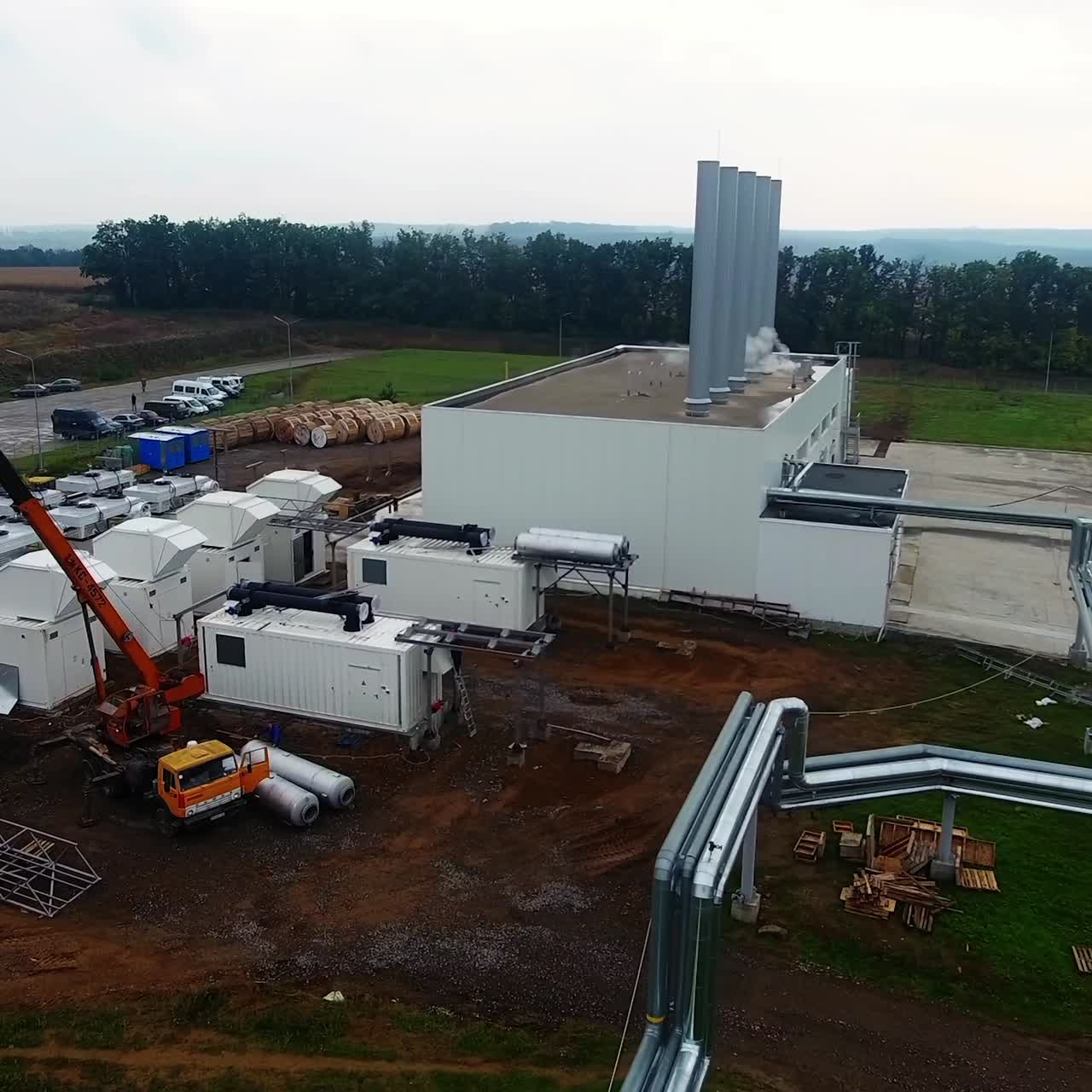 Large industrial zone with plants aerial view. Many factories from the air. Span over an industrial area with modern factories