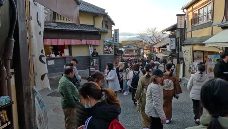 crowded market street with diverse visitors and shops