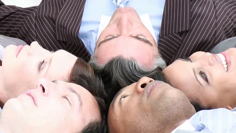 business team on floor in a circle