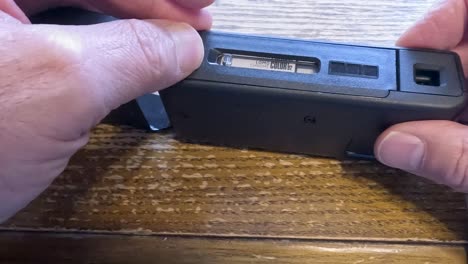 loading an old 110 film camera with a modern film