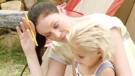 mother with her daughter in the garden