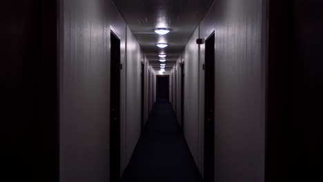 Dolly-down-a-creepy-lit-hallway