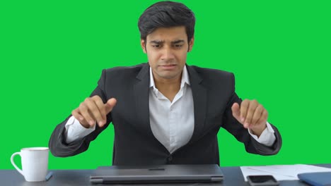 Angry-and-stressed-Indian-employee-closes-the-laptop-Green-screen