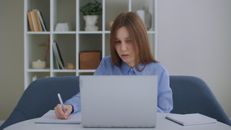 focused business woman entrepreneur typing on laptop doing research. young female professional using computer sitting at home office desk. busy worker freelancer working on modern tech notebook device