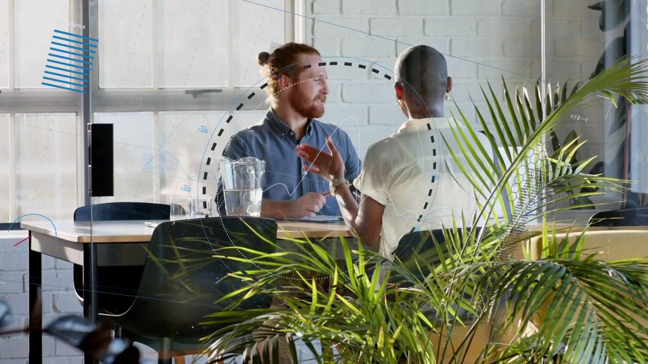 Man smiling, leaning forward initiating business talk with peer while waveform graphics mark notes