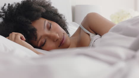 beautiful african american woman waking up in bed after restful sleep smiling happy ready for new day