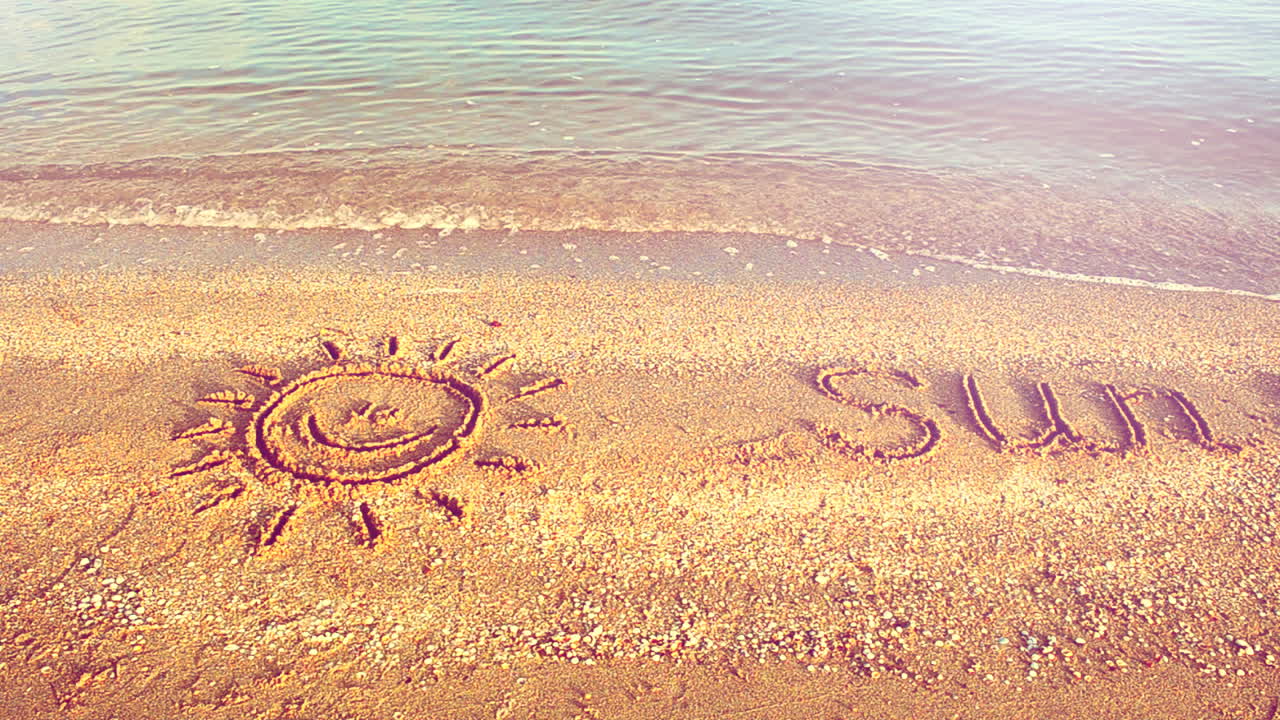 Sun drawing on the beach. Beach and drawing