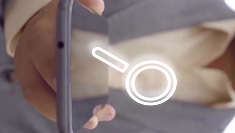 man dressed in a suit holding a phone on which an animation of a search magnifying glass appears in front of the camera