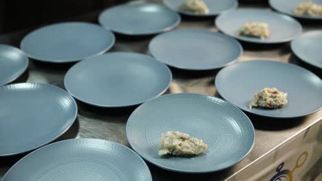 prepared dishes on plates in a kitchen