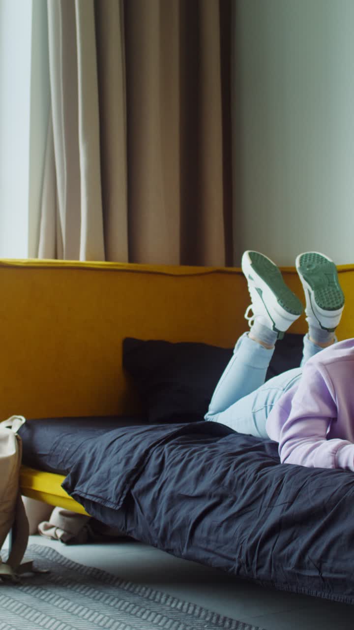 Girl playing video games in her bedroom