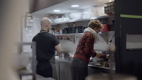 restaurant kitchen staff preparing food