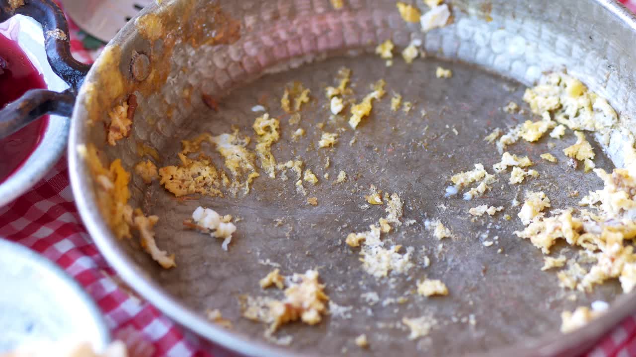 Empty Pan with Scrambled Egg Leftovers