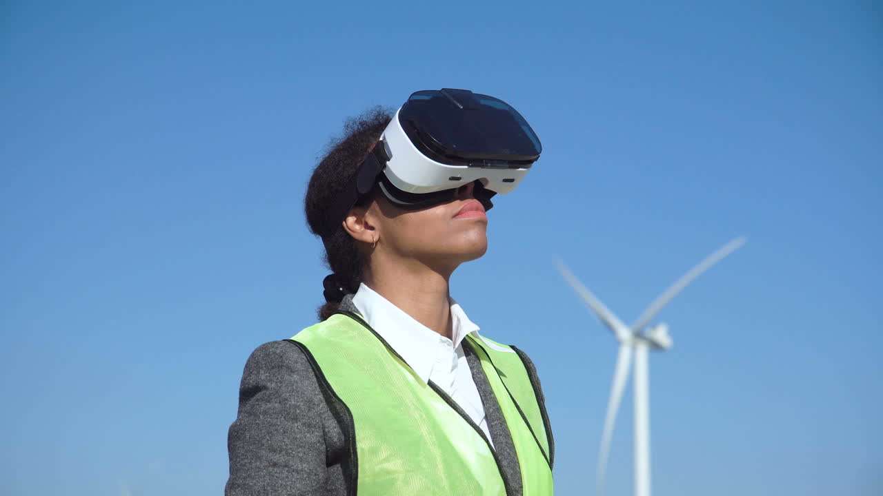 Engineer using VR headset at wind farm