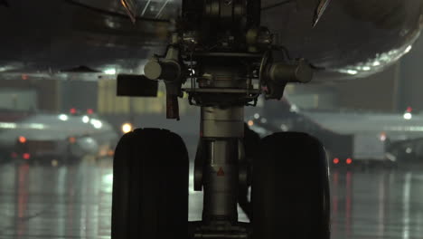 Airplane-wheel-view-at-rainy-evening