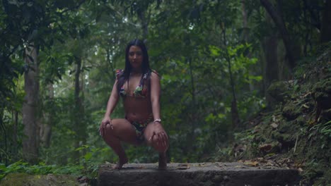 a girl in a bikini amid the lush caribbean waterfall landscape.
