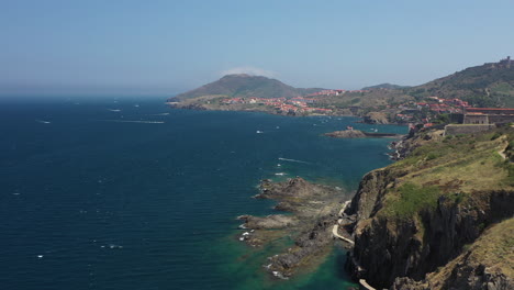 aerial shot near the historical town and port of collioure and the french spanish border at the mediterranean sea