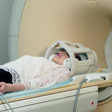 female patient in mri device. modern medical equipment in hospital. woman doing tomography in a magnetic resonance image machine.