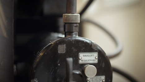 a detail of an original heidelber cylinder printing machine, regulation pump moving up and down