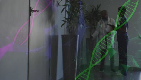 animation of dna strand and connections over diverse doctors working at hospital