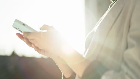 Hands,-outdoor-and-woman-with-a-smartphone