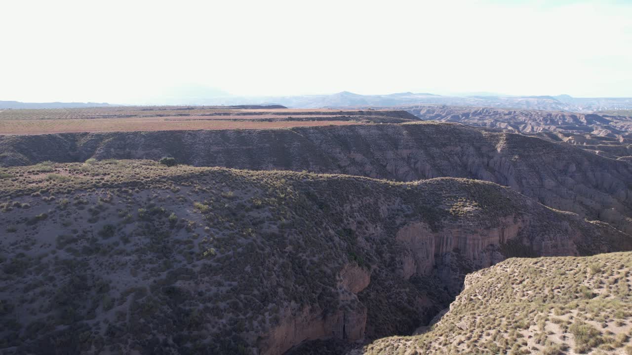 Drone view of a dry terrain in a sunny day. Gorafe desert in Granada, Spain