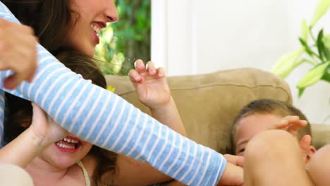 family tickling each other