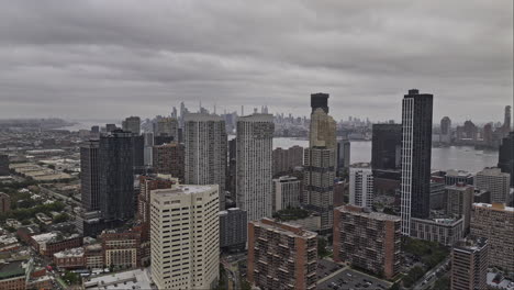 Jersey-City-New-Jersey-Aerial-v18-low-flyover-historic-downtown-capturing-waterfront-cityscape-and-NYC-Manhattan-views-on-the-skyline-against-overcast-sky---Shot-with-Mavic-3-Pro-Cine---September-2023