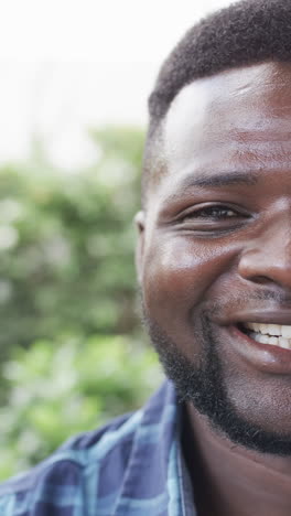 vertical video: middle-aged african american male smiling, close-up shot