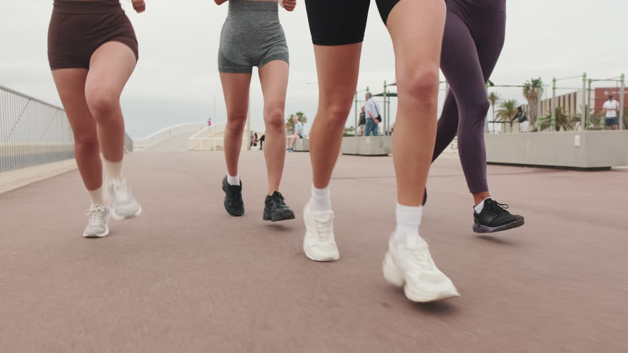 Friends Jogging by the Sea