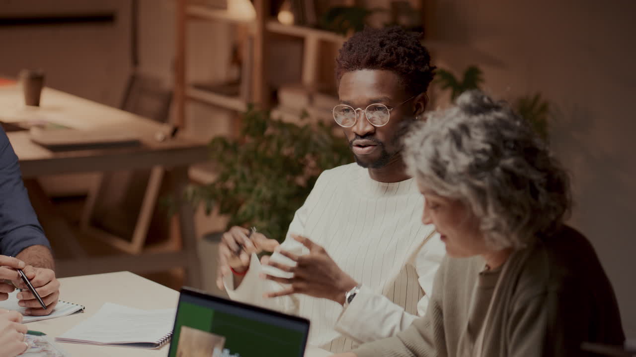 Group of Engineers Having Discussion about Sustainability and Renewable Energy