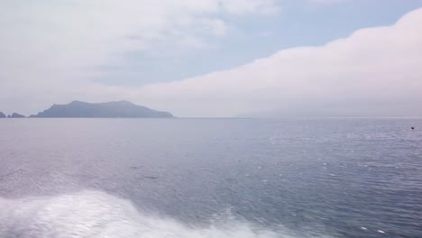 Wide gimbal shot approaching Anacapa Island by boat at the Channel Islands National Park off the coast of California