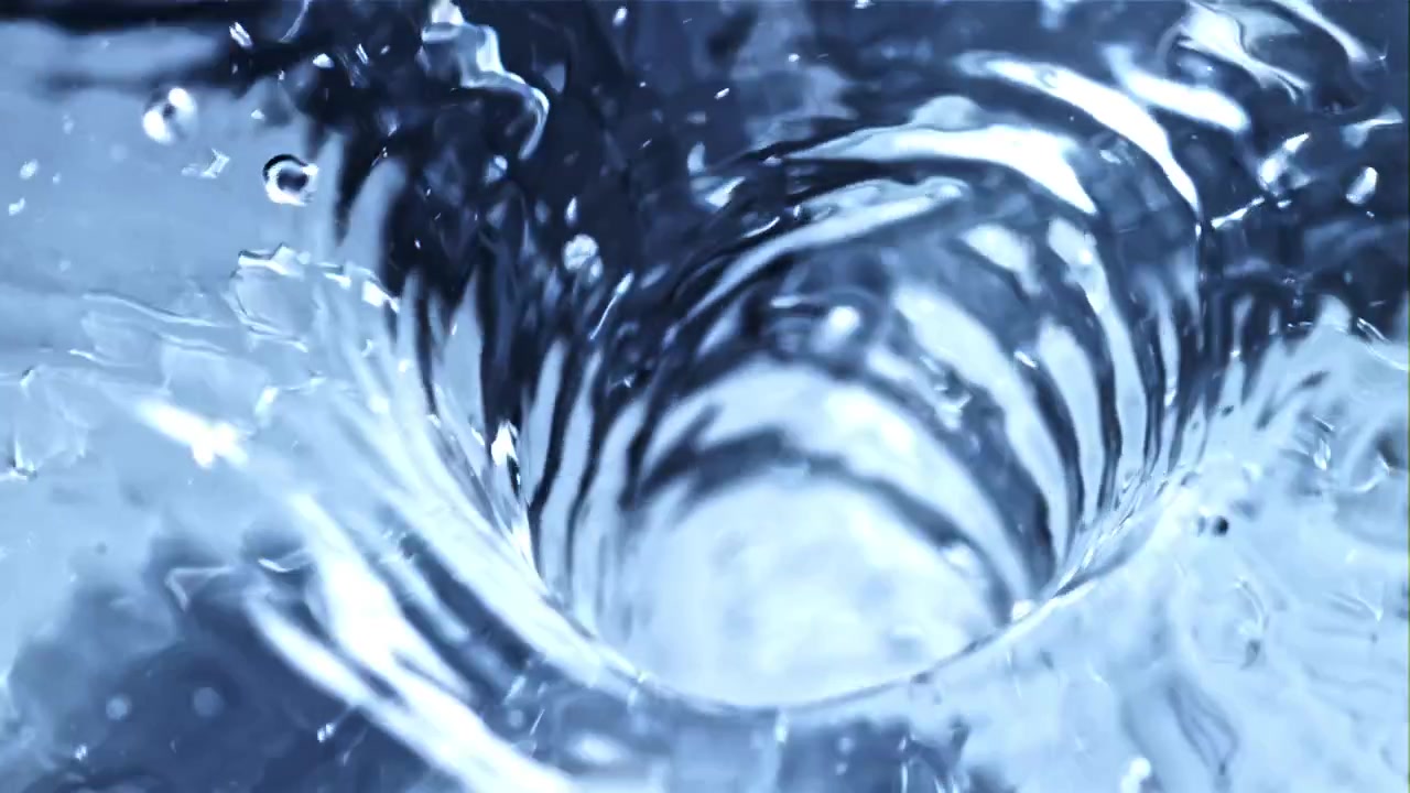 Close Up of Water Swirling Down a Drain Forming a Vortex