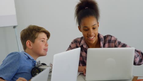 Kids using laptop in training institute 4k