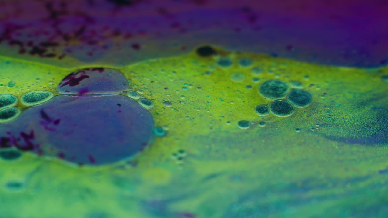 Colourful, organic, liquids macro shots buzzing and flowing