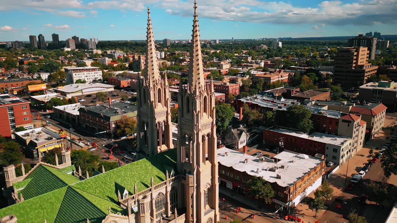 Denver, USA, 28 July 2025: Flight around the stunning Cathedral Basilica of the Immaculate Conception. Cityscape of Denver, Colorado, USA with lush greenery at backdrop