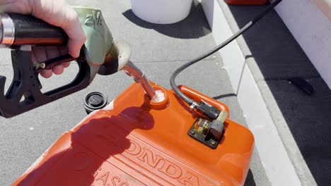 gasoline spills while refueling a boat container