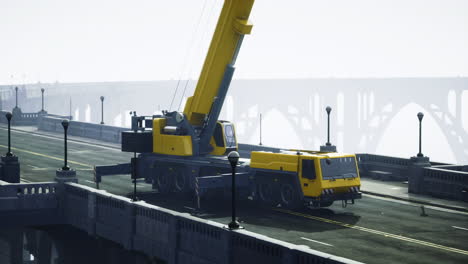 crane working on a bridge construction project during foggy weather