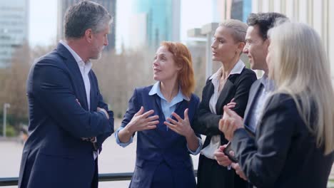 business professionals engaging in an outdoor discussion