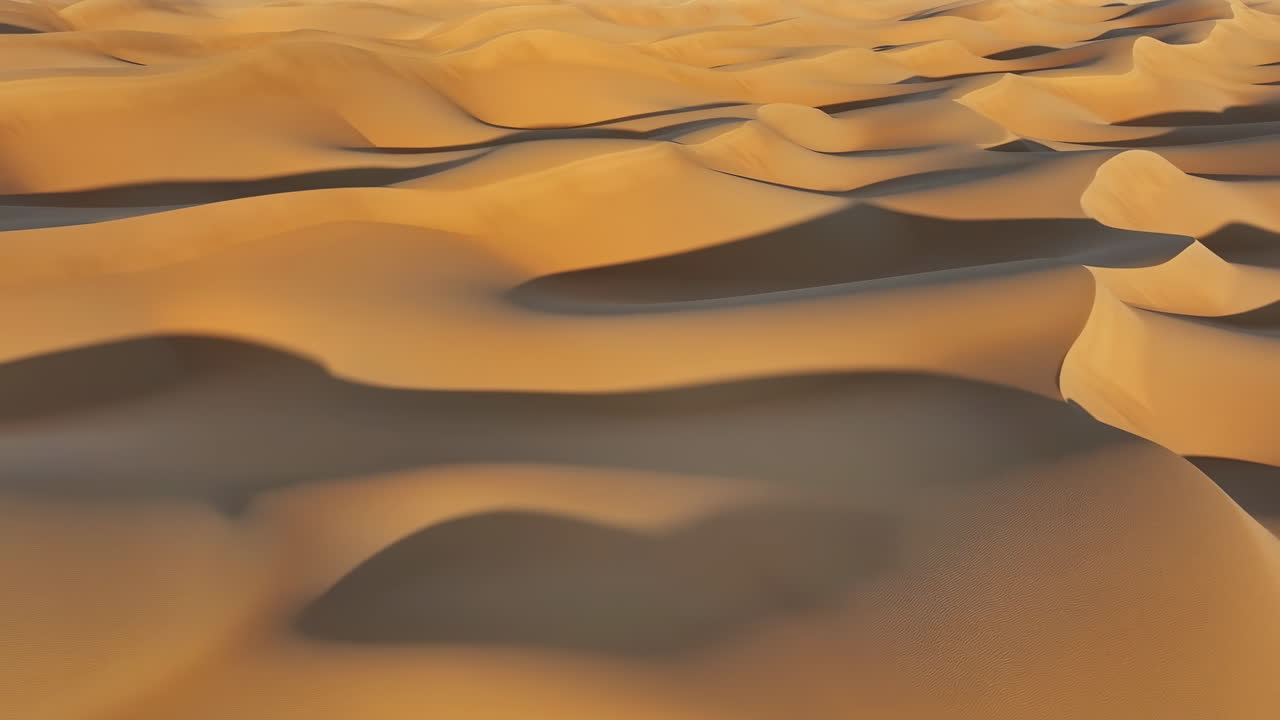Dune di sabbia dorate e ondulate che si estendono all'orizzonte, creste illuminate dal sole e ombre morbide creano un paesaggio arido e tranquillo.