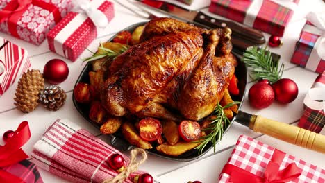 roasted whole chicken or turkey served in iron pan with christmas decoration