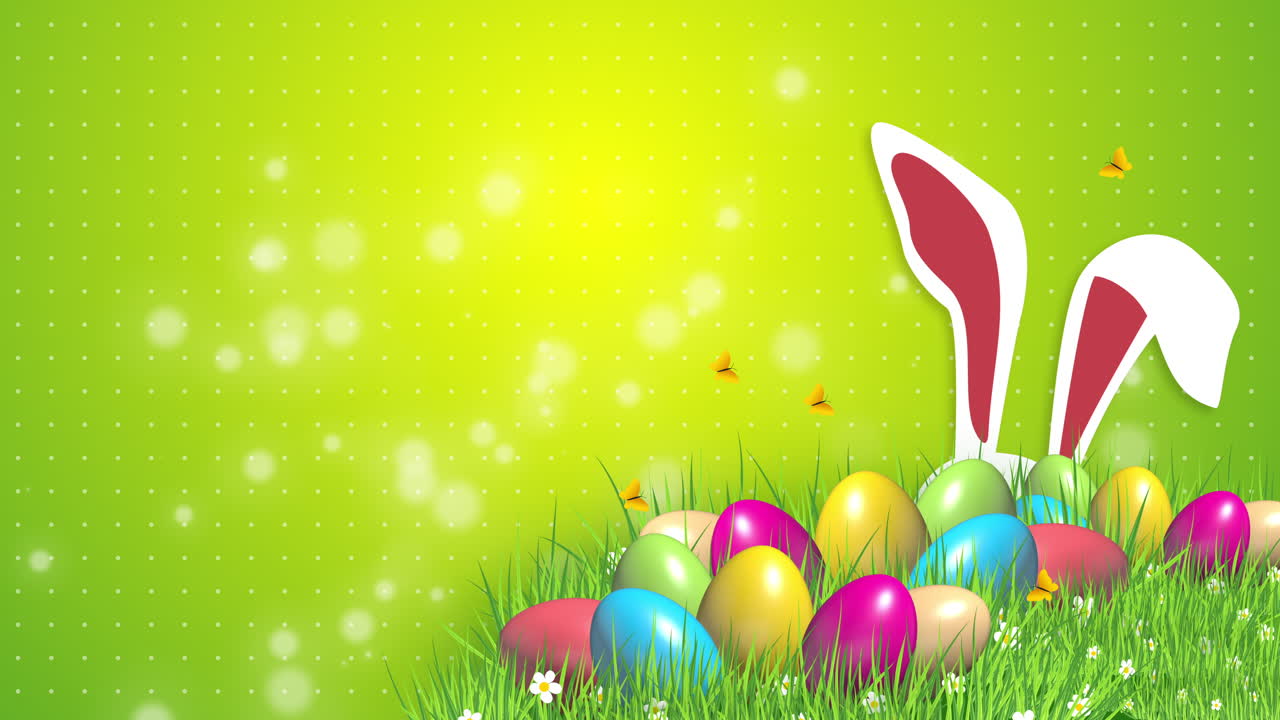 Festive animation with Easter colored eggs on green grass and rabbit ears. Abstract background with blurred particles. Looped video.