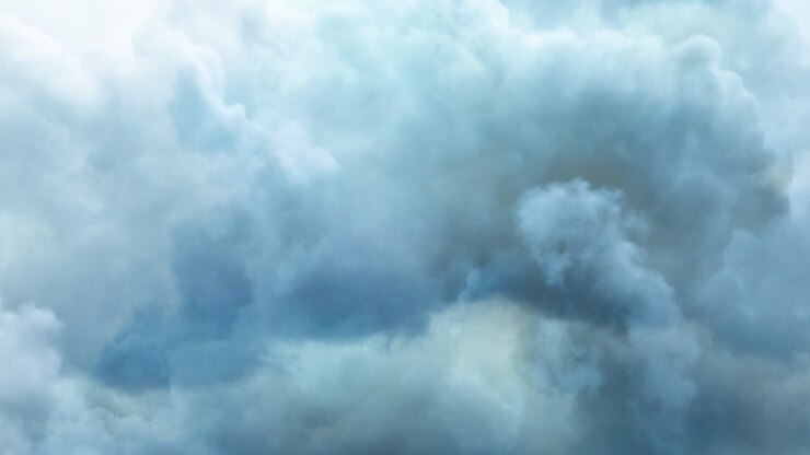 white clouds floating in the blue sky