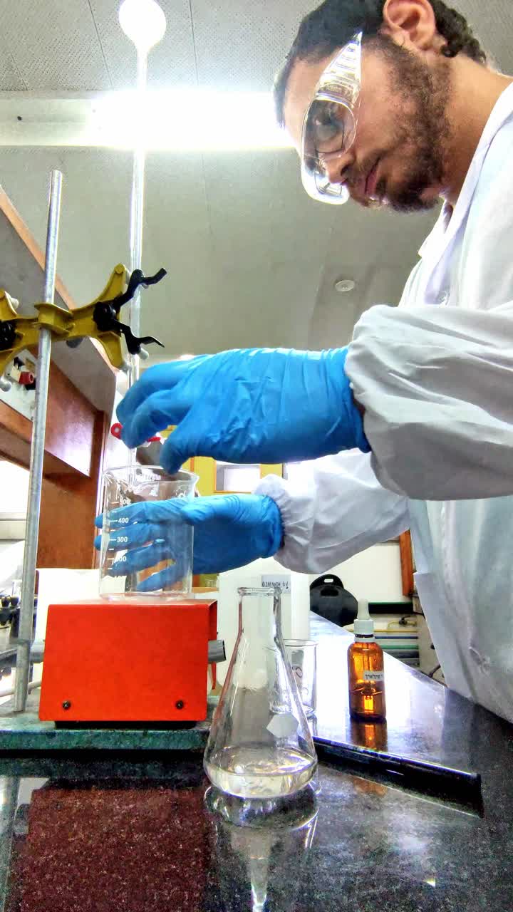 Scientist in Lab Performing Chemical Experiment