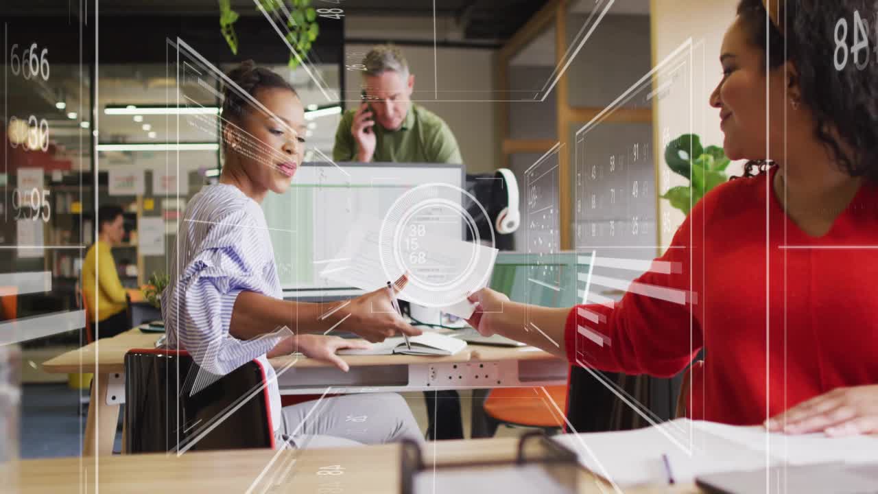 Office worker typing data on desktop after colleague handing papers while animated charts scrolling